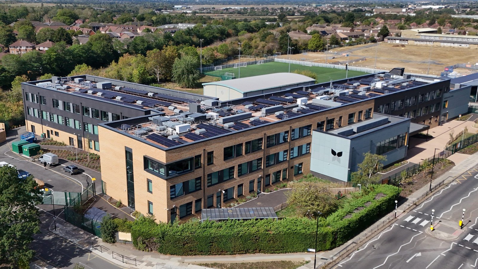 Completed Islip Manor High School viewed from above, with solar panels on the roof