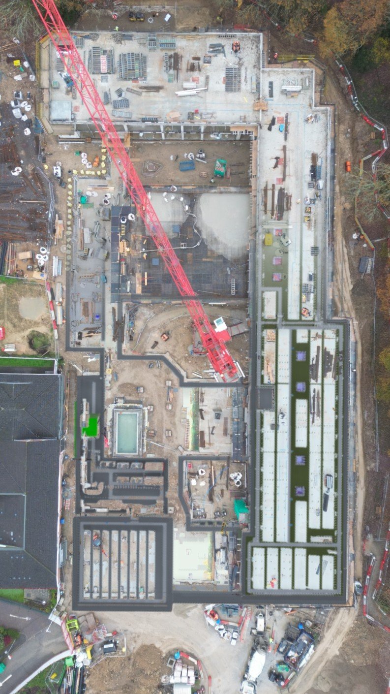 Top-down aerial overview of the school construction site